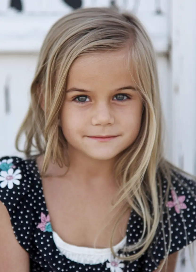 girl haircut summer Soft Layers with a Free-Spirited Side Part