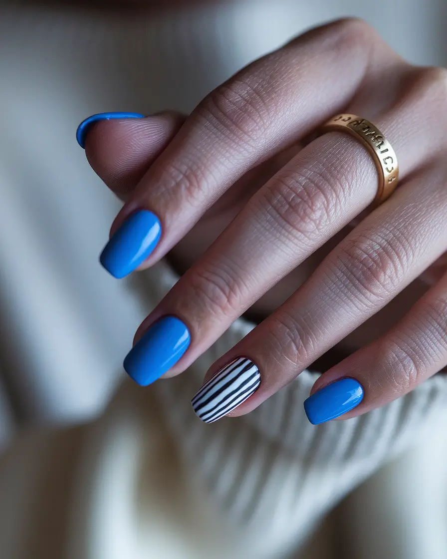 june nails ideas 2025 Blue Crush with a Stripe Twist