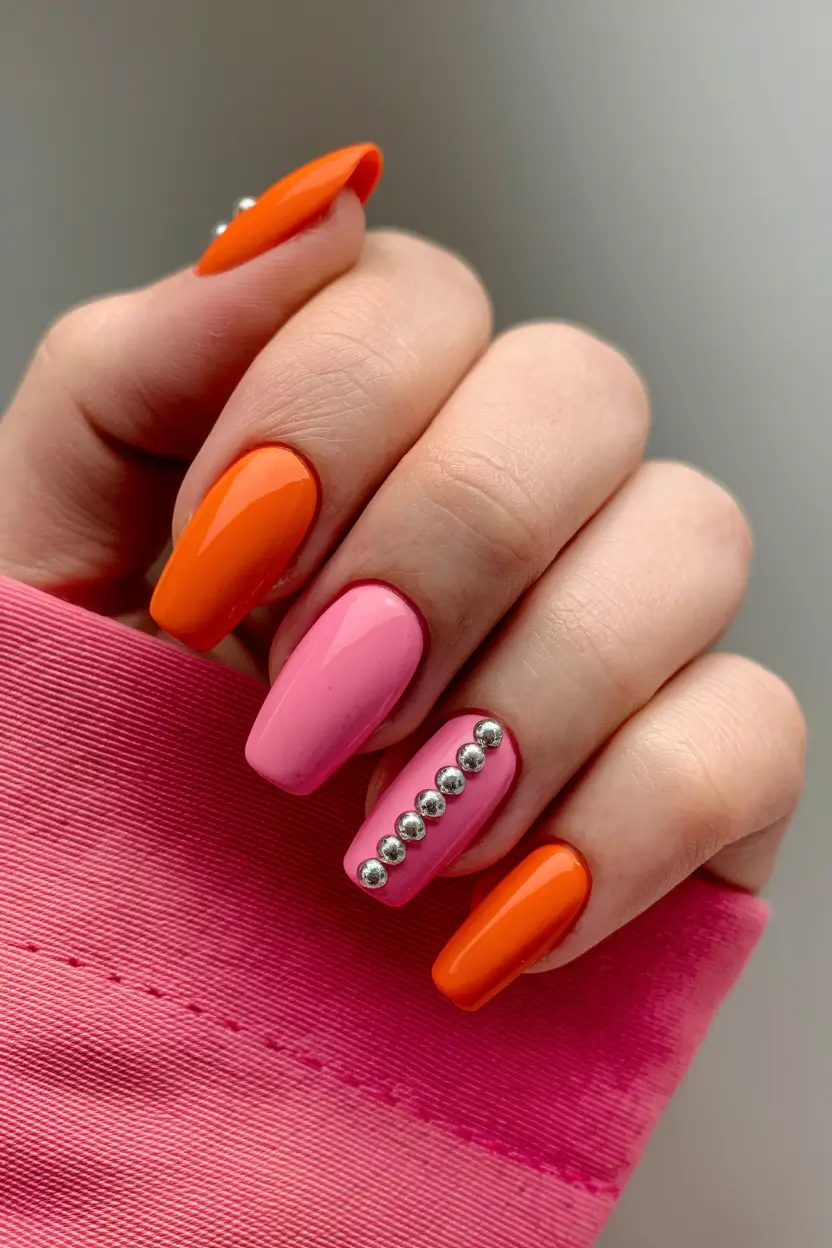 summer nail art ideas 2025 Punchy Pink & Orange Duo with Studs