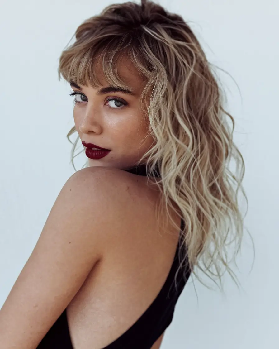 haircuts for curly hair Fluffy Texture Meets Baby Bangs: A French-Girl Summer Dream