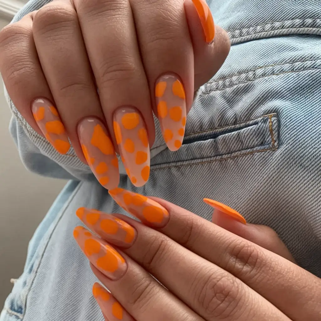 july nails ideas 2025 Orange Sorbet Polka with a Sheer Glow