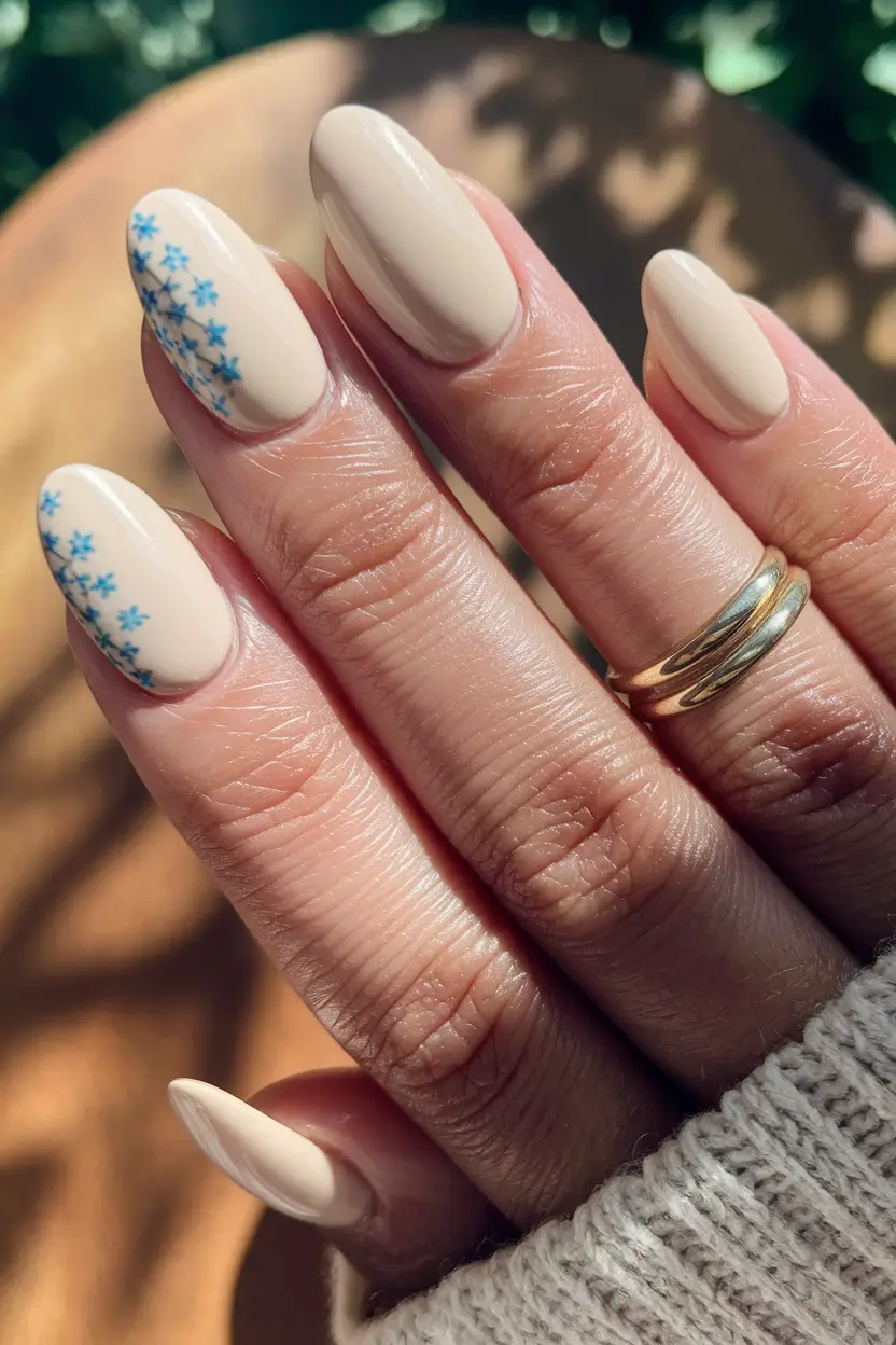 summer round nails ideas 2025 Delicate Blue Floral on Nude Canvas
