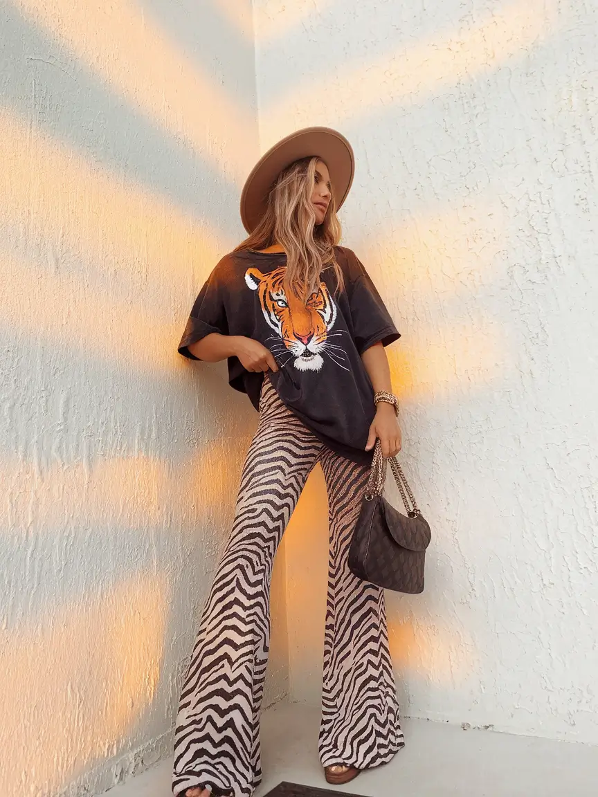 august outfits Graphic Tee and Zebra Flare Pants for Bold Expression