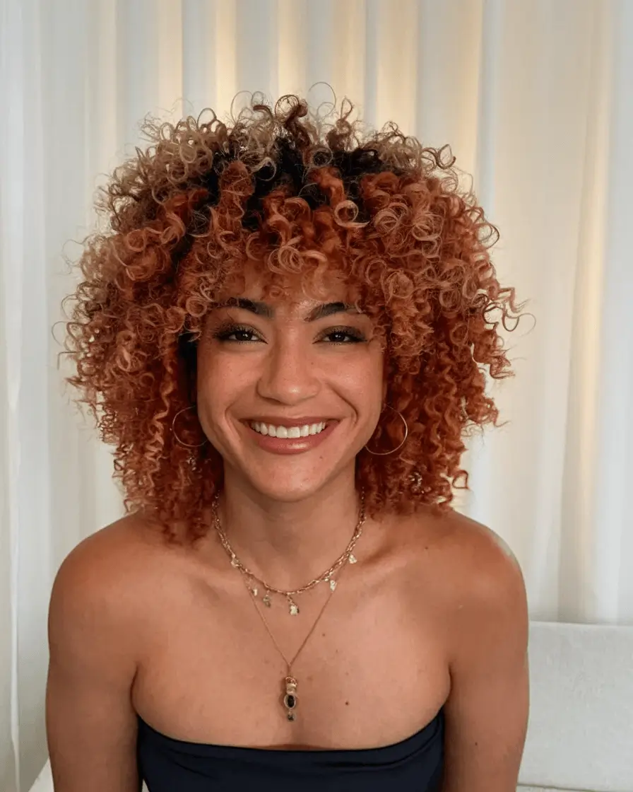 fall haircuts 2025 round face Bold Curly Bob in Auburn-Copper