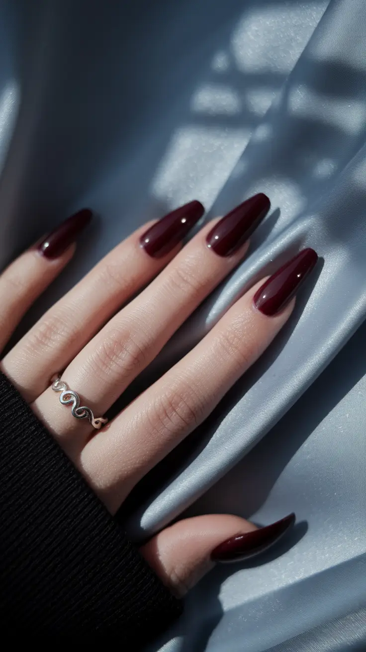 long fall nails 2025 Glossy Merlot Almond Nails