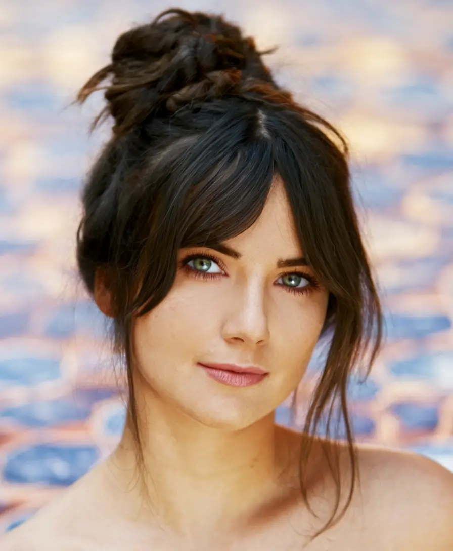 cute fall hairstyles Textured Top Knot with Bangs