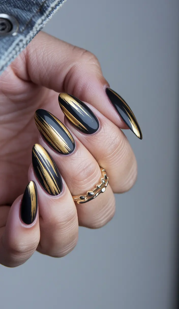 dark fall nails 2025 Black and Gold Striking Strokes