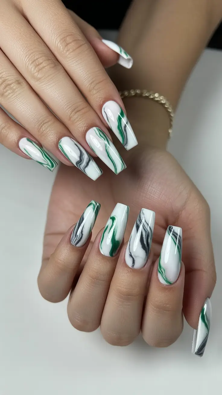coffin nail designs 2026 Marbled Green and Black Swirls for Bold Artistic Drama