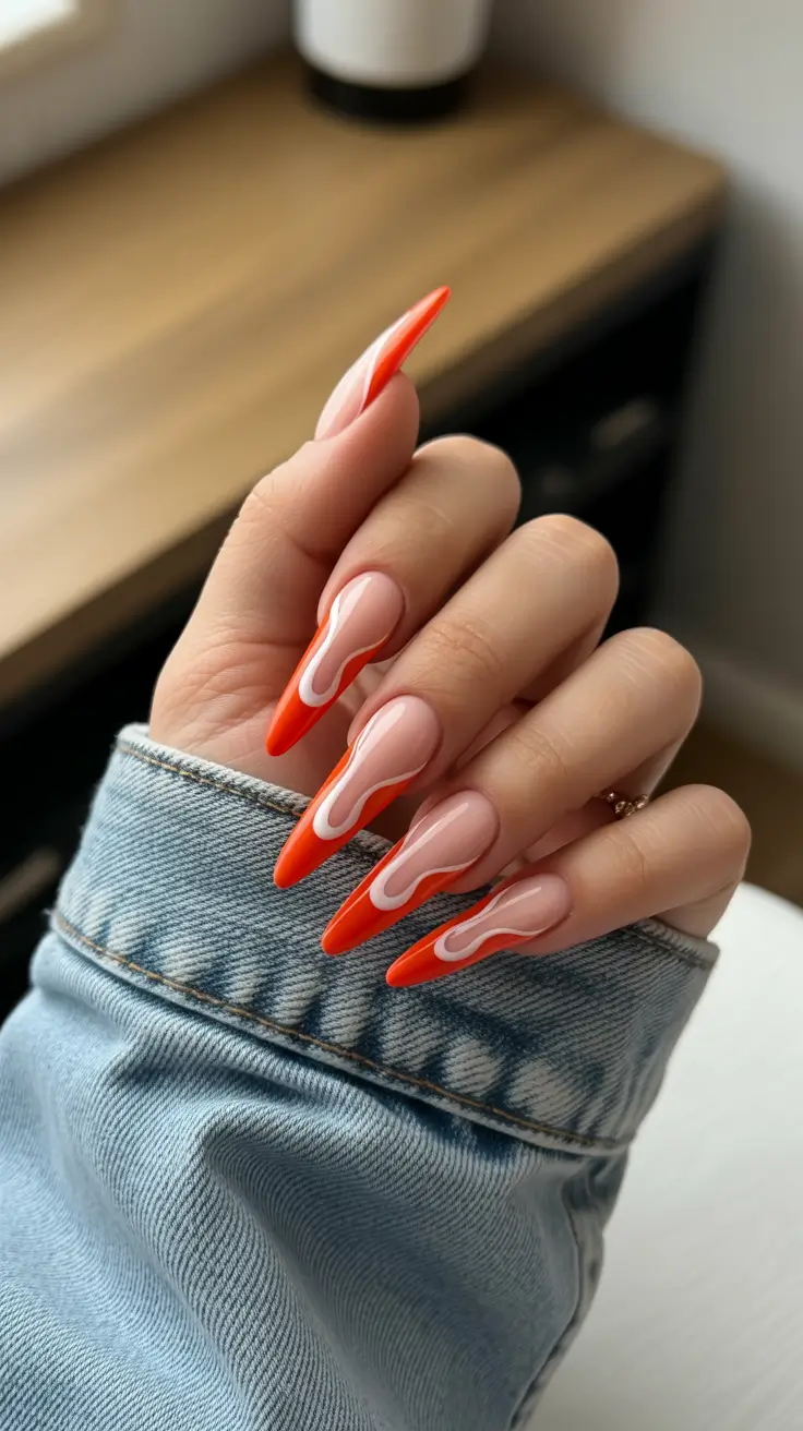 red nails trend 2026 Long Sculpted Red With Wavy White Accents