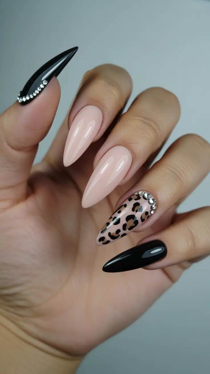 stiletto-nails-designs-2026-Black-Gloss-With-Leopard-Sparkle-Drama