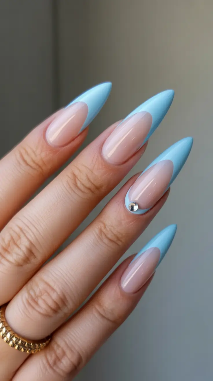 stiletto-nails-designs-2026-Sky-Blue-Contoured-French-With-Crystal-Detail