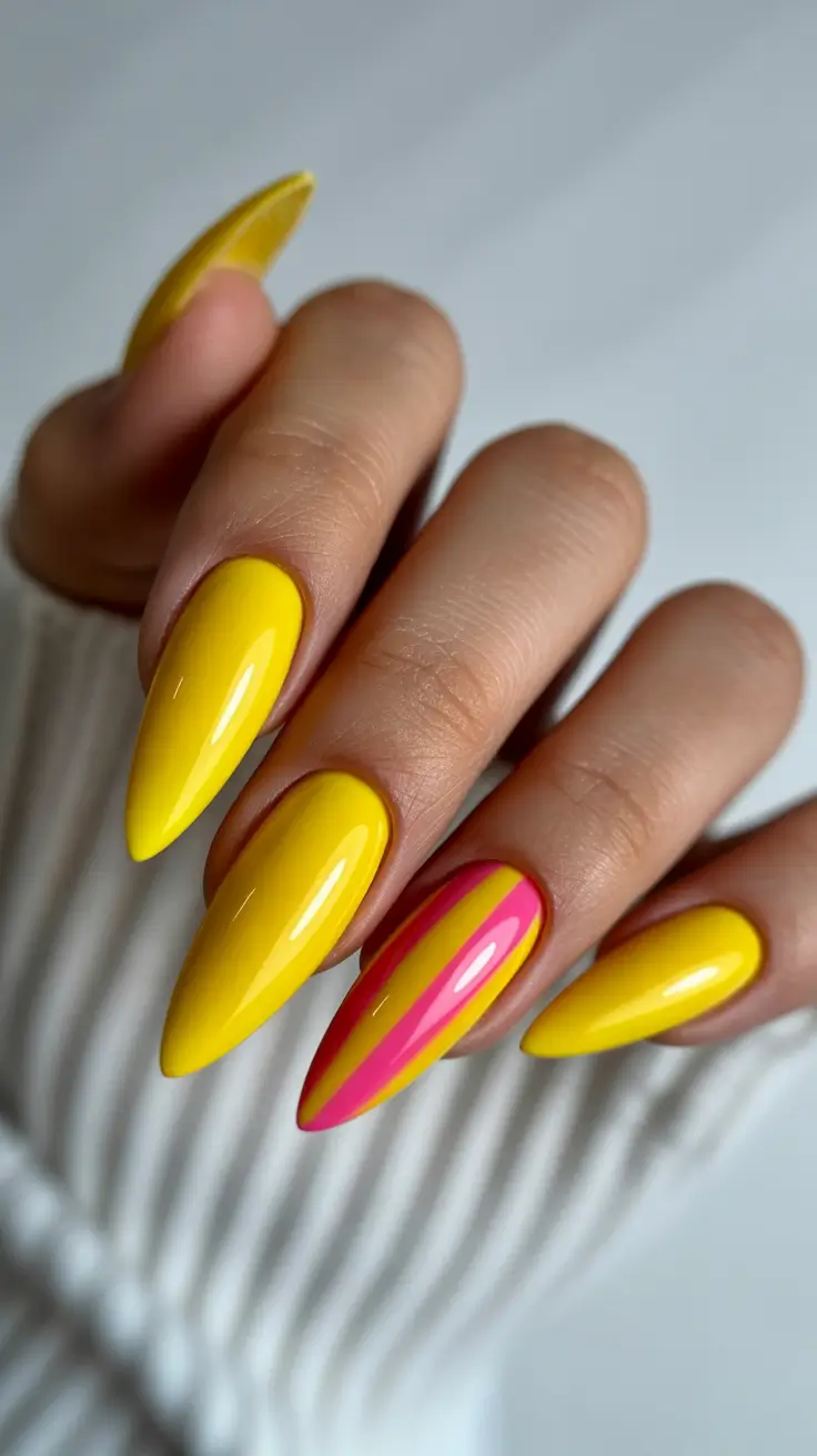 yellow nails trend 2026 Bold Stiletto Citrus With a Pink Pop
