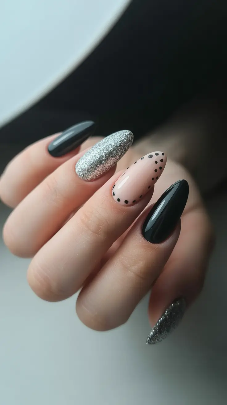 february nails 2026 Black and Silver Almond With Minimal Dot Detail