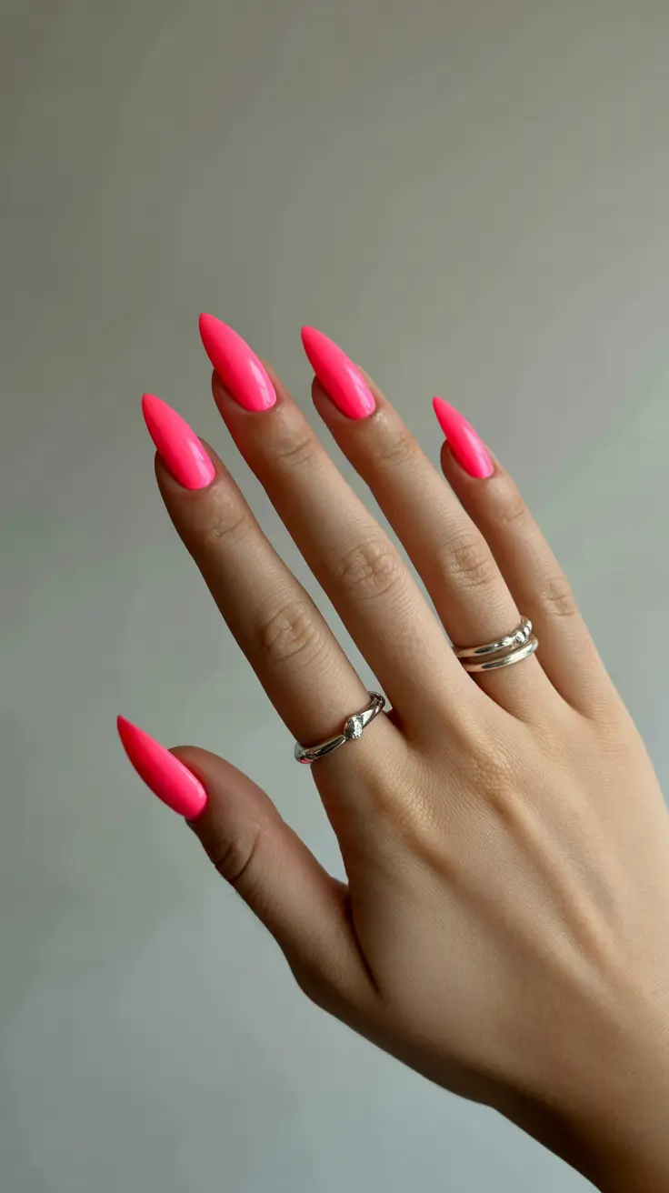 chic colorful spring nails 2026 Electric Pink Stiletto Statement Nails