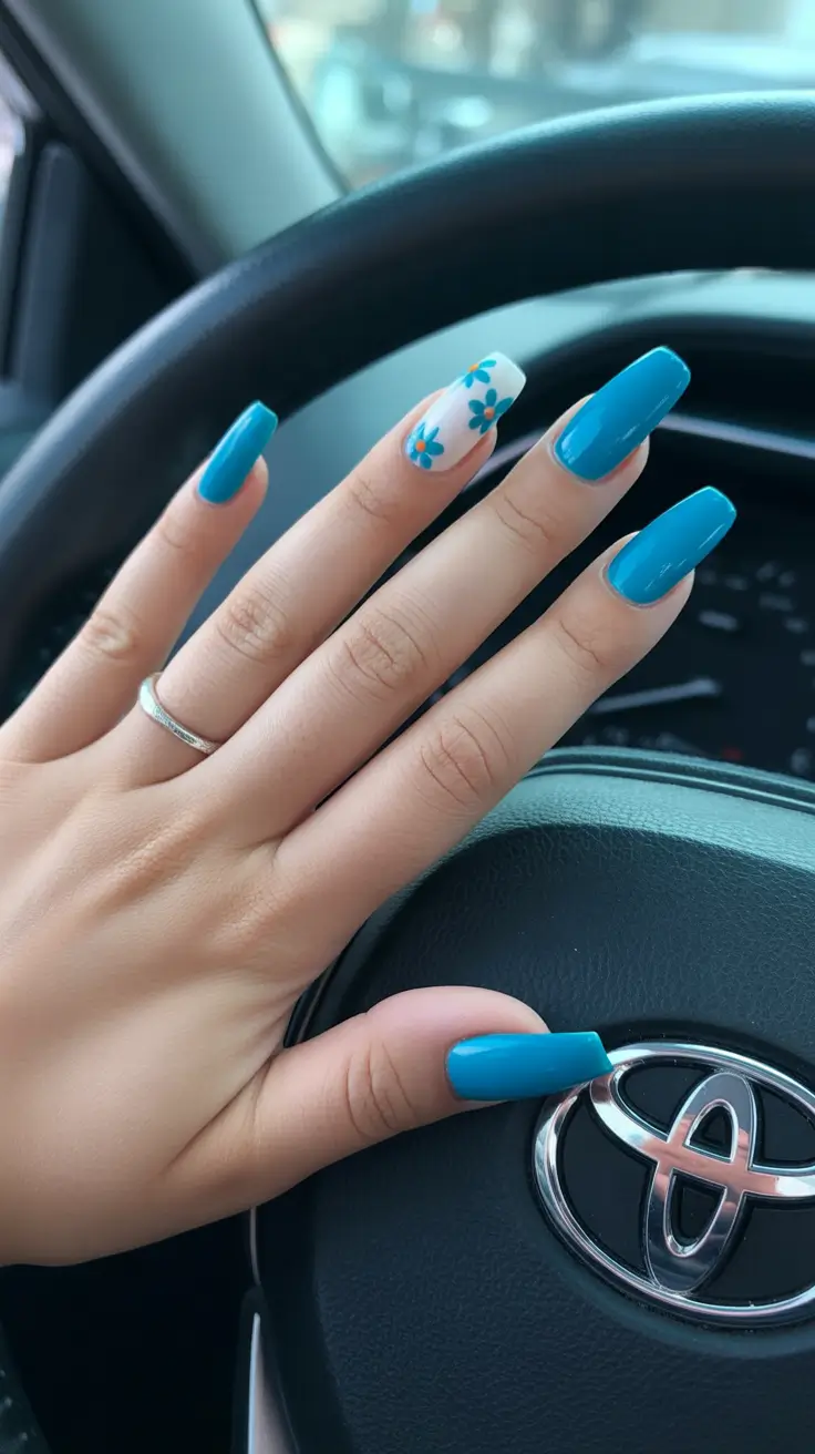 early spring nails 2026 Bold Blue Acrylic With Floral Accent