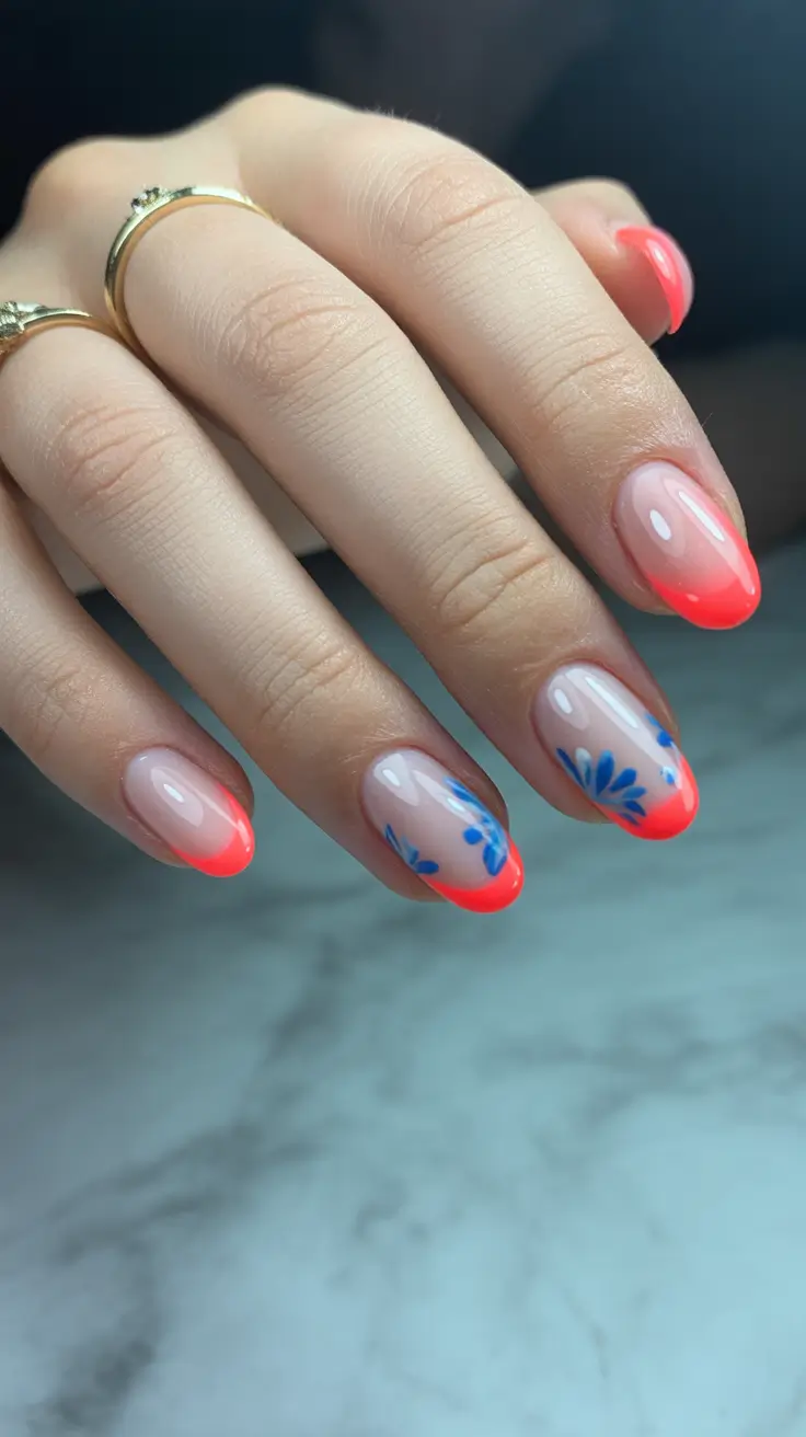 bright spring nails 2026 Coral Glow French With Blue Petal Art