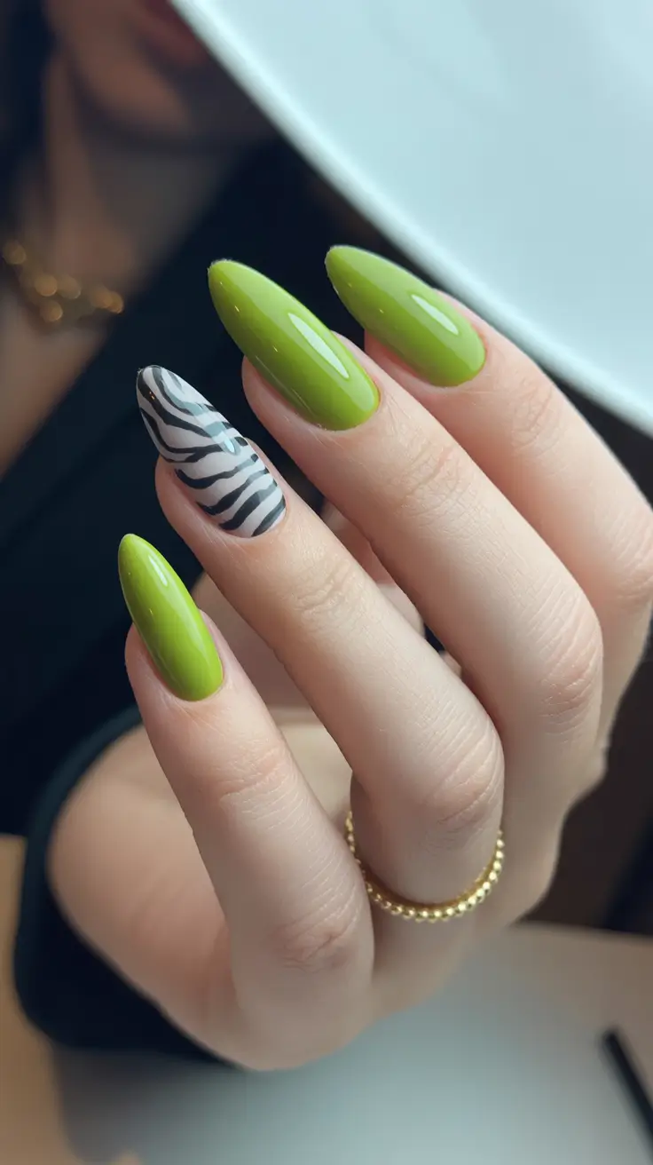 best spring stiletto nails 2026 Glossy Olive Green Stiletto Nails with Graphic Zebra Art