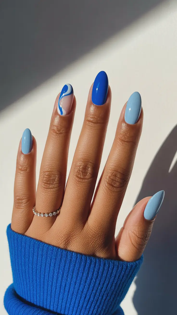 gorgeous spring nails for dark skin 2026 Cool blue contrast nails for modern graphic elegance