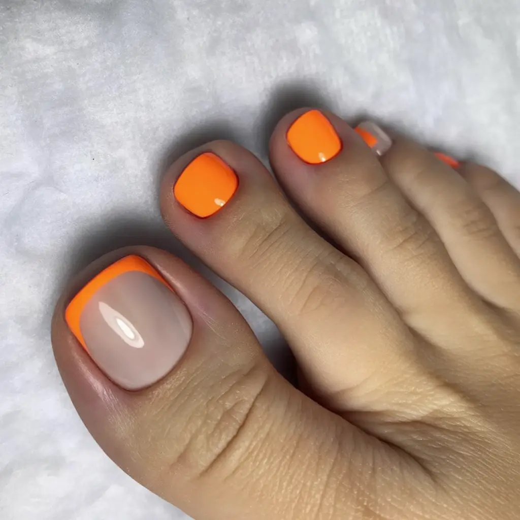 pastel spring toe nail color 2026 Vibrant Orange Pop with Minimalist Nude Accent