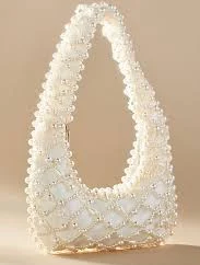 Cream pearl beaded handbag with gold hardware from...