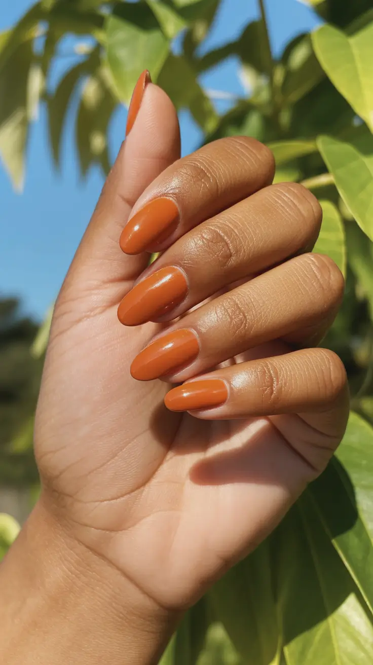 sophisticated spring nails for brown skin 2026 Warm Terracotta Almond Nails For Sunlit Spring Days