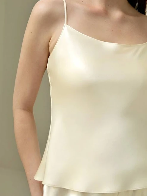 Sleeveless high-neck satin shell top with a relaxed fit