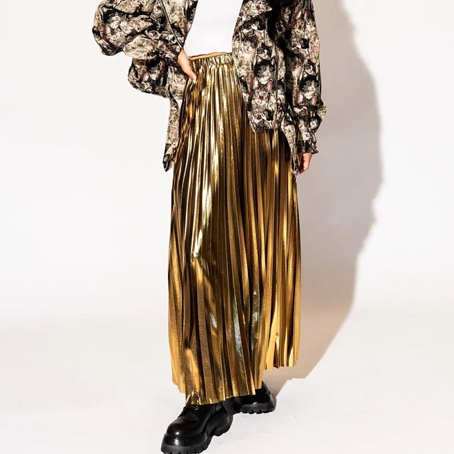Dressed in Lala Metallic Pleated Midi Skirt in 24 Karat Gold