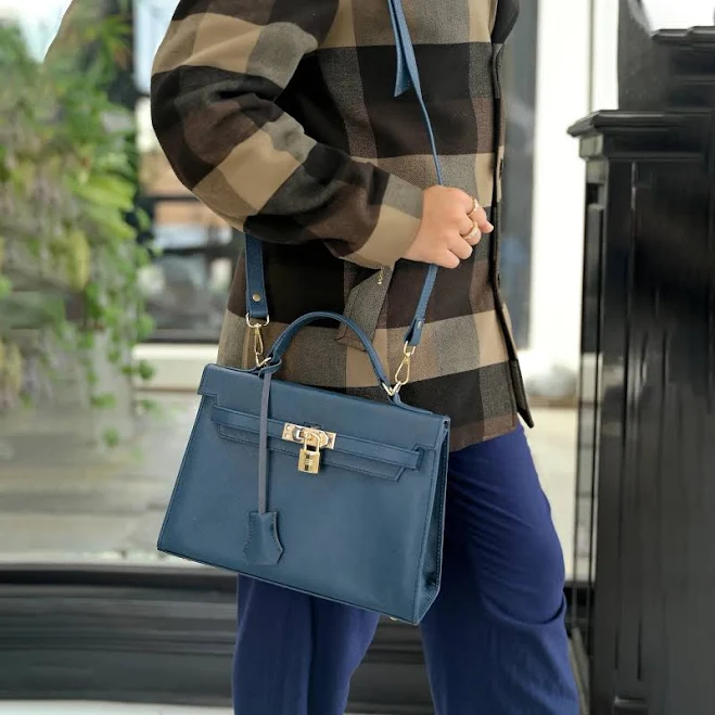 Structured navy crossbody bag with gold hardware