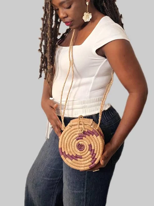 Round raffia crossbody bag with a long strap