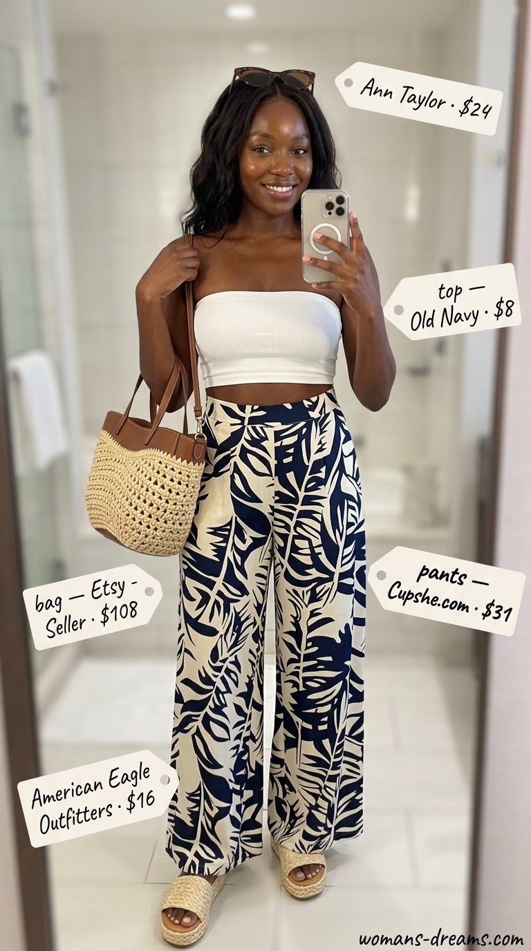 Summer outfits black woman 2026: Blue tropical palazzo pants with white bandeau and raffia sandals for a vacation.