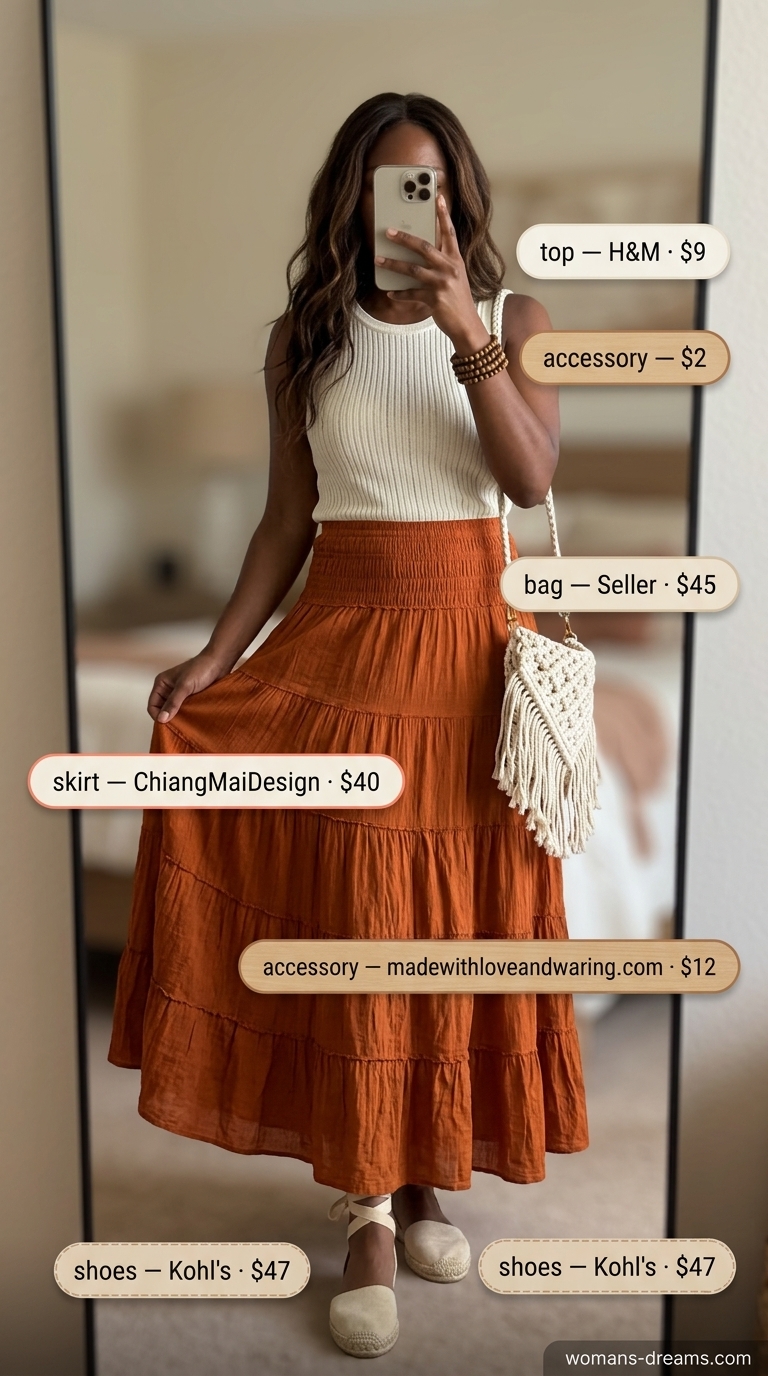 Terracotta tiered maxi skirt for summer outfits black woman 2026, styled with cream tank and macrame bag for a boho look.