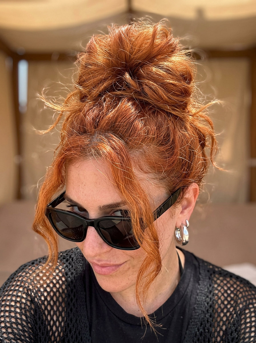 long copper-red textured top knot with ginger tones and messy chic finish for summer
