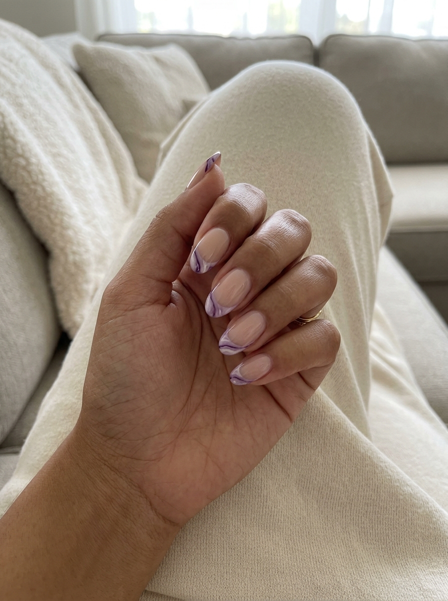 Artistic Lavender Marble French 2026 Artistic Lavender Marble French nails for weddings, with lavender, white, and purple veins. Cute summer nails 2026.