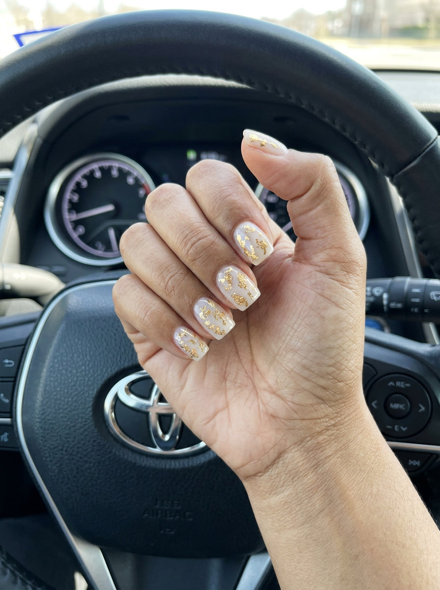 Easy Summer Nails 2026: Gilded Nude Foil Gilded Nude Foil Flakes: Easy summer nails 2026 with milky nude gel and gold foil accents for a glamorous look.