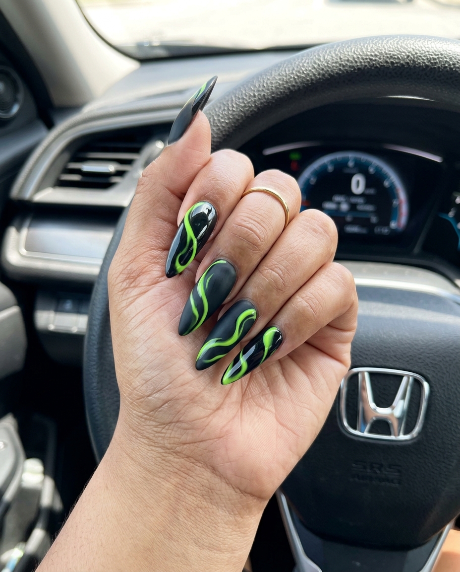 Electric Lime Swirls Stilettos: Bold Party Nails 2026 Edgy electric lime green swirls on matte black stiletto nails, perfect for a bold summer night out. Cute summer nails 2026.