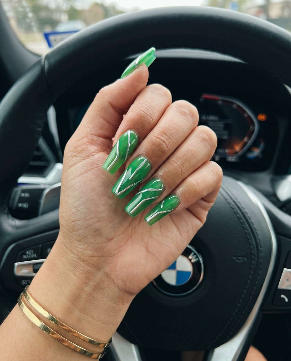 Electric lime green chrome line nails for June 2026, edgy festival style. Medium square nails with silver geometric lines.