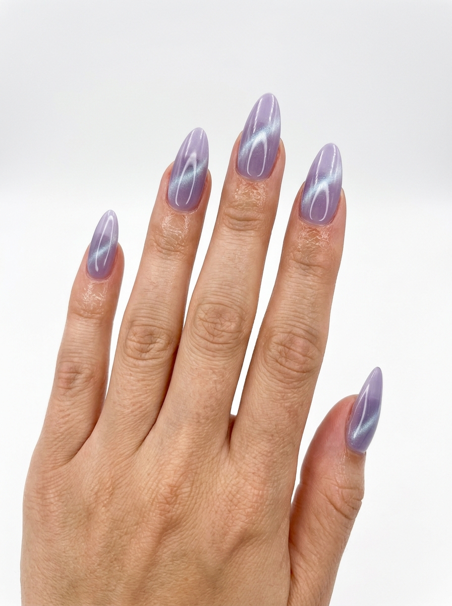 Mystic Lavender Cat-Eye Nails: Sultry Evening 2026 Mystic lavender cat-eye almond nails with a subtle silver-blue shift. Sultry and mysterious cute summer nails 2026.