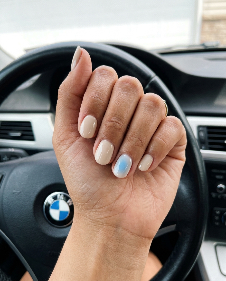 Sky Blue Aura Accent Nails 2026 Short round summer nails 2026: Sky blue aura accent on creamy neutral for daily wear or relaxed gatherings. Modern.