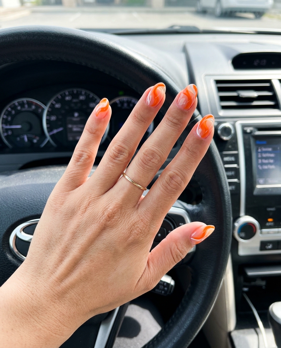 Citrus Stained Glass Nails 2026 | Vacation Style Clear coffin nails with vibrant tangerine stained glass swirls for summer colorful nails designs 2026. Vacation vibes.