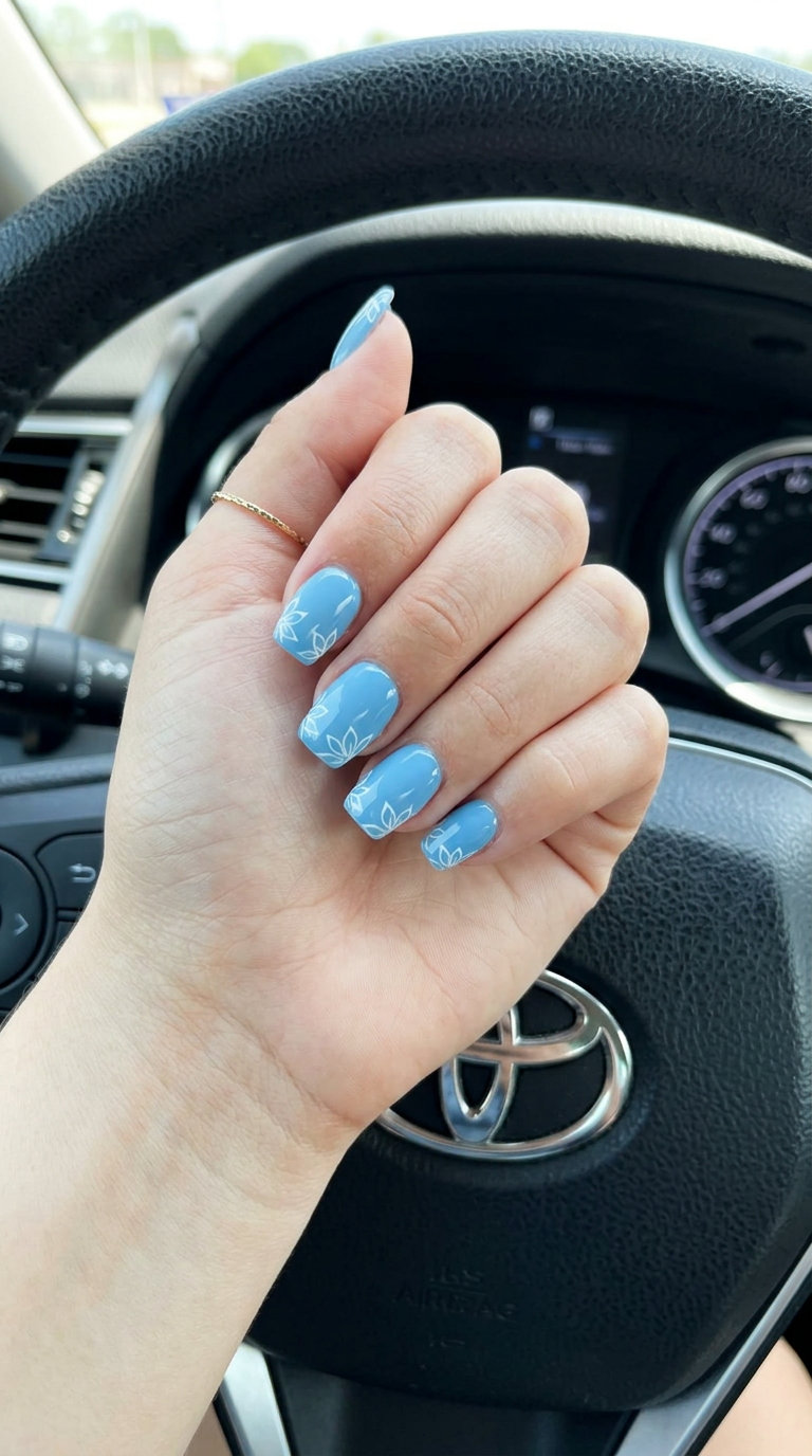 Sky Blue Outline French Nails 2026: Minimalist Chic Sky Blue Abstract Outline French nails for daily wear or office in 2026. Minimalist chic with white floral outlines.