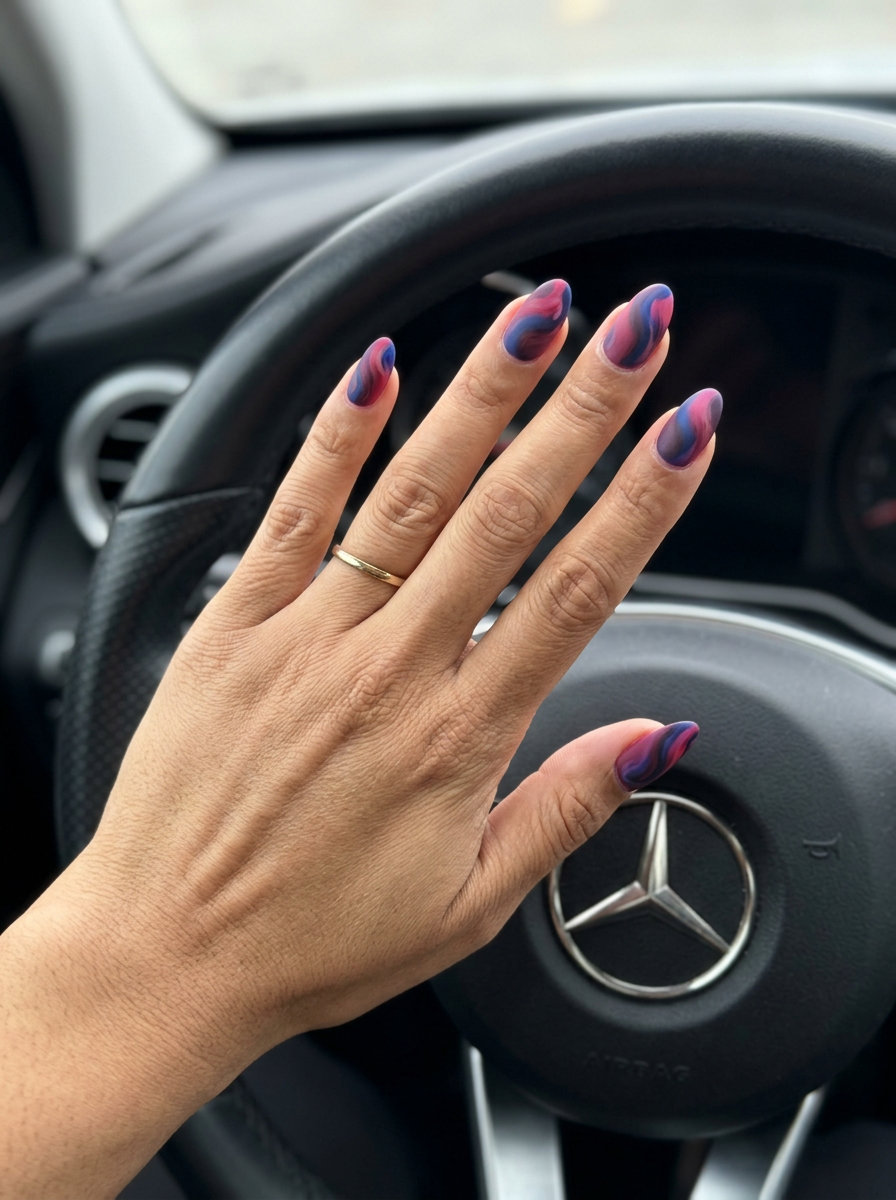 Long matte coffin nails with abstract mixed berry swirls for an elegant look.