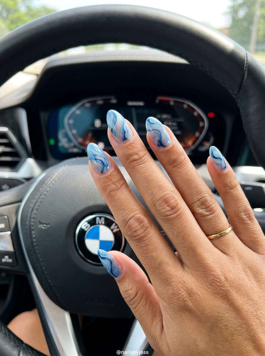 Sheer blue marble negative space coffin gel nails for vacation. Summer gel nails 2026.