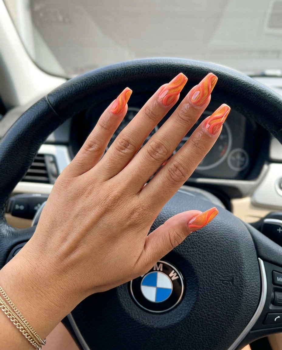 Vibrant Coral Cat-Eye Swirls nails for a bold summer 2026 date night or party look.