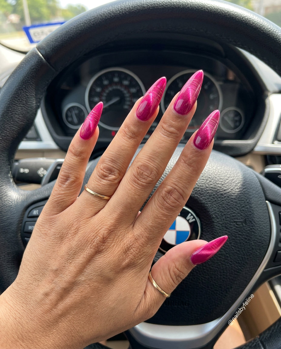 Sultry feline pink gaze nails with magnetic pigment, a bold option for summer hot pink nails designs 2026.