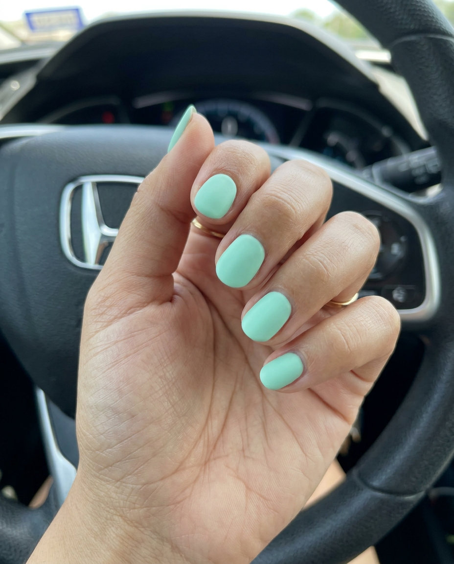 Mint Green Frosted Finish: cool mint green with a matte, frosted glass effect, a refreshing summer nail color 2026.