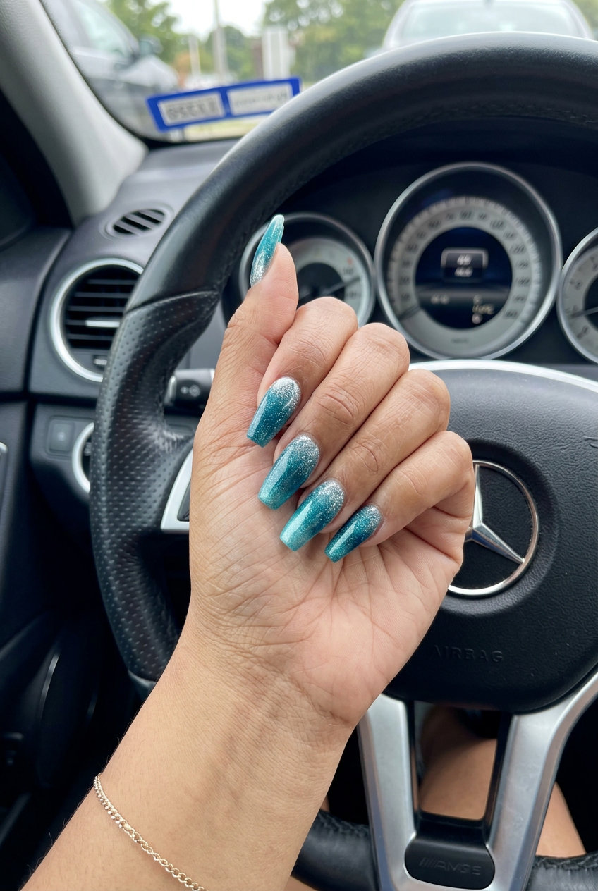 Ocean Teal Shimmer Gradient: deep teal to turquoise with silver shimmer, a sultry summer nail color 2026.