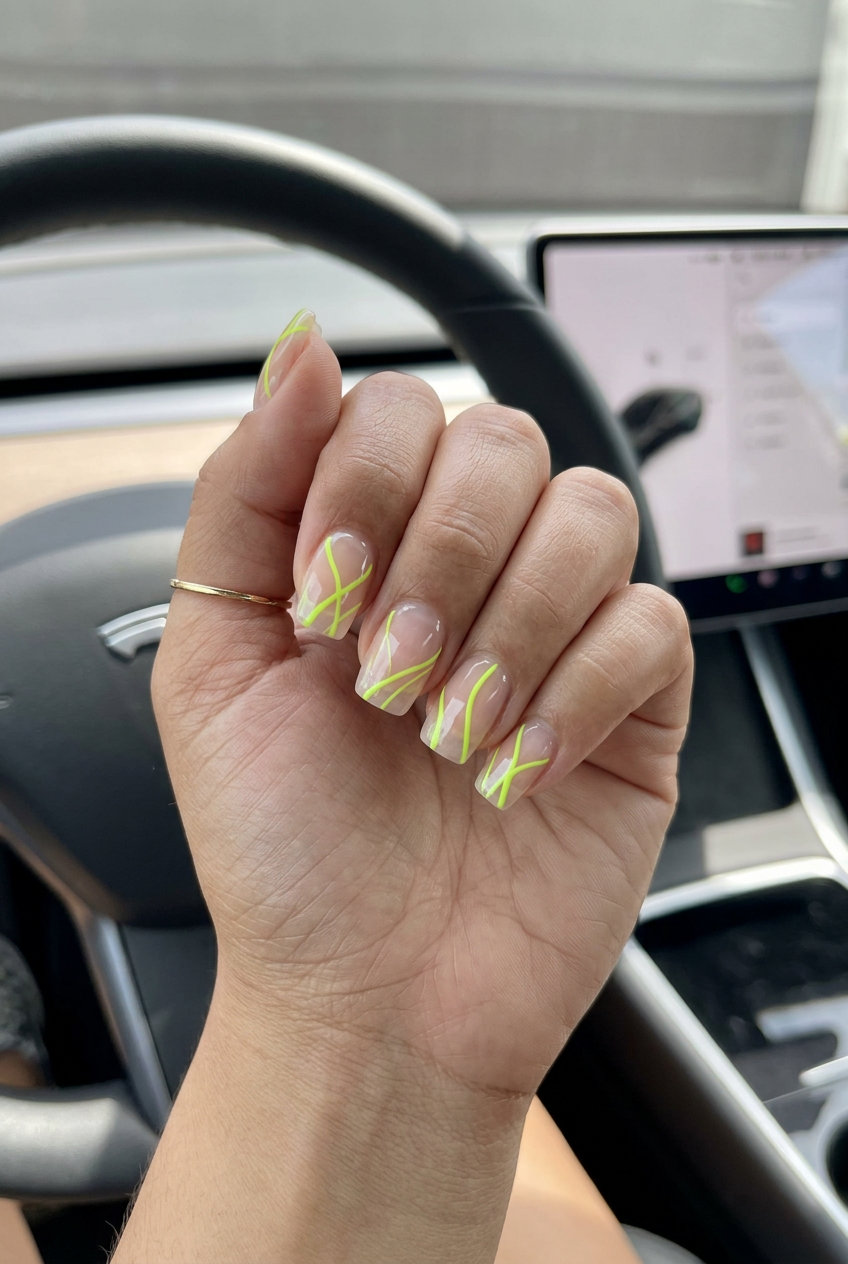 Edgy lime green abstract lines on medium square nails for vacation and festivals. Summer nails square medium 2026.