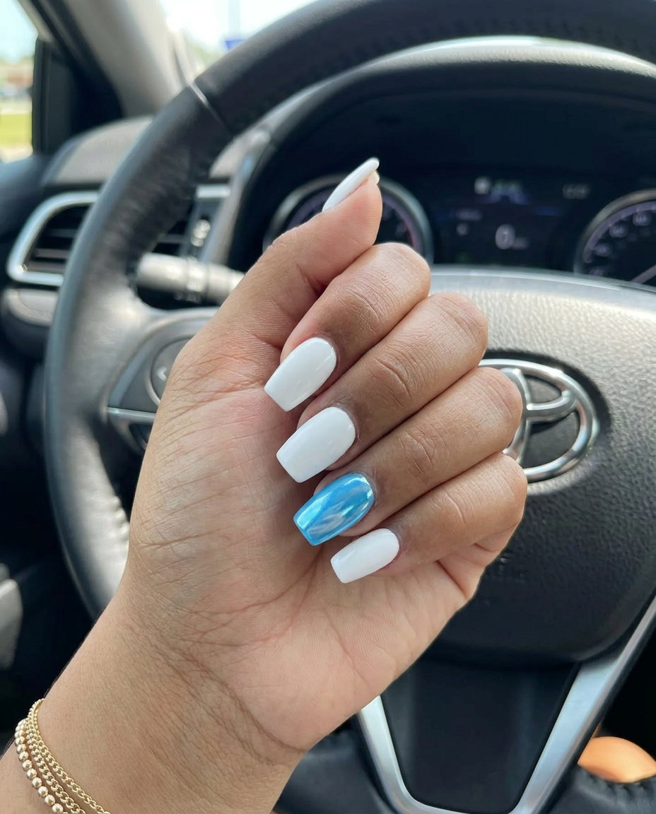 Sky blue chrome accent nails for summer 2026. Medium square, white with iridescent sky blue chrome ring finger. Futuristic & bold.