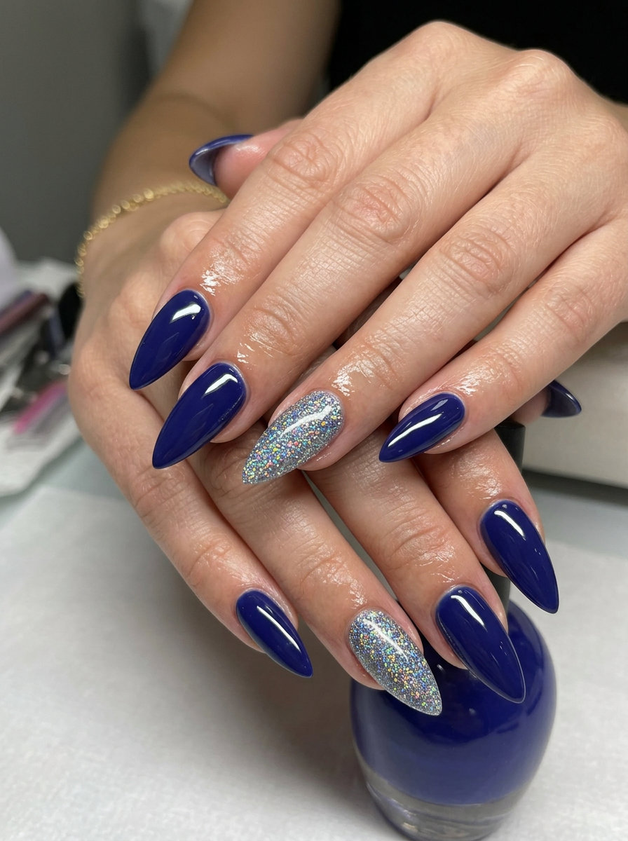 Cosmic Glitter Stiletto Nails 2026: Festival Glam Cosmic glitter accent stiletto nails for summer vibes 2026. Glamorous for festivals and nights out.