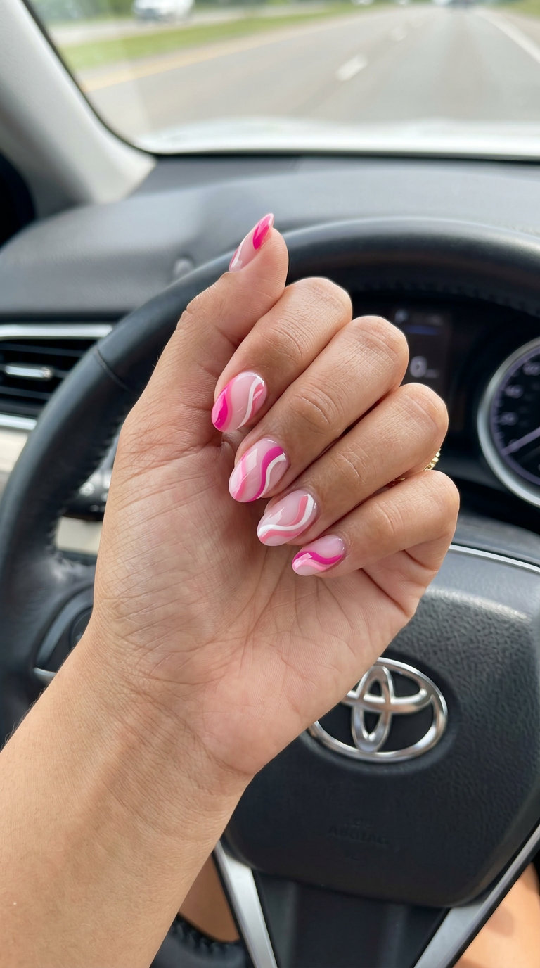Summer Vibes Nails 2026: Pink Abstract Swirls Summer vibes nails 2026: Playful pink abstract swirls on medium square nails.